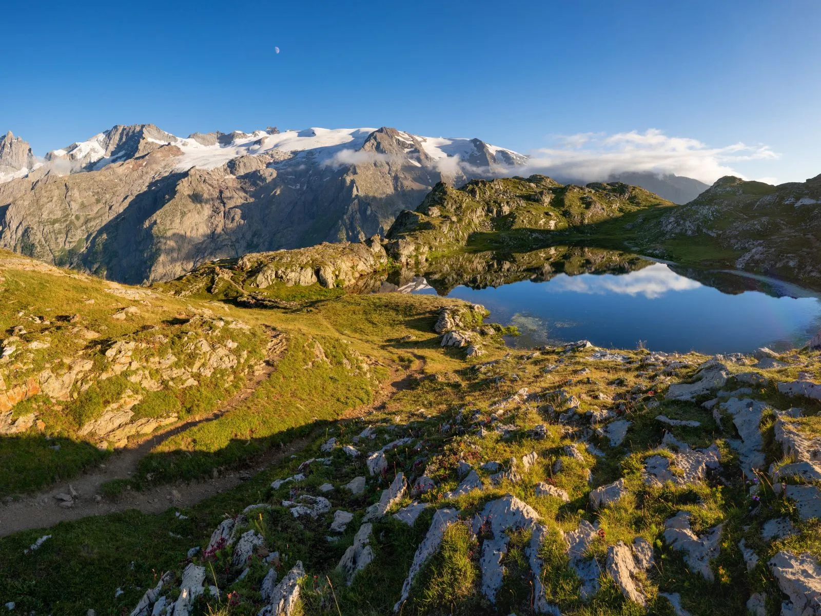 emparis plateau and lerie lake with view on the ecrins national park and the la meije peak in the alps gr 54 hiking trail in the oisans massif