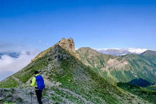 hiker reaching a pass in the ecrins national park french alpshiker reaching a pass in the ecrins national park french alps copie