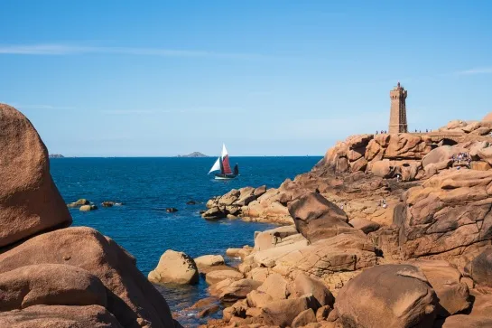 beautiful seaside landscape with sailing boat and ploumanach lighthouse at pink granite coast frabl03